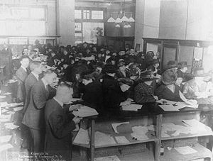 People filing tax forms in 1920